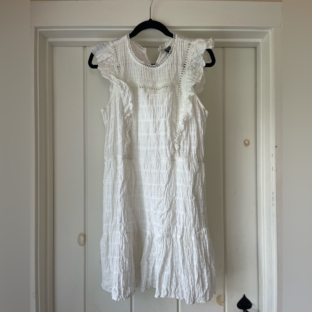 White dress. Ruffles.